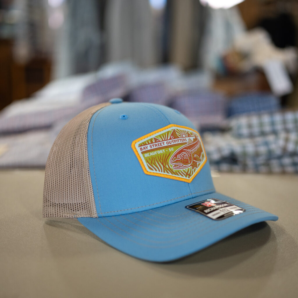 112 Columbia Blue/Khaki Tailing Reds Patch Trucker
